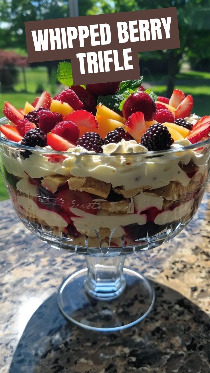 A vibrant dessert featuring layers of summer berry trifle